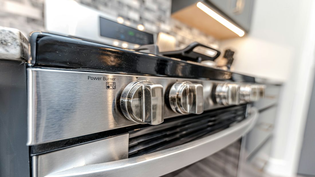 Control knobs on a stainless steel range cooker